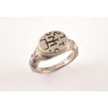 A SILVER MERCHANTS RING probably 19th century, engraved with initials. Size S