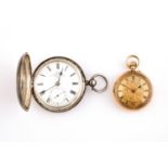AN 18CT GOLD OPEN FACED POCKET WATCH the gold coloured foliate dial with Roman numerals, metal inner