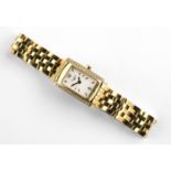 A LADY'S 18CT GOLD AND DIAMOND WRISTWATCH BY LONGINES the signed rectangular-shaped white dial