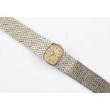 A LADY'S GOLD WRISTWATCH BY ROLEX the signed cushion-shaped dial with Roman and baton numerals, with