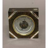 AN ANEROID BAROMETER, by J.C. Vickery, the silvered dial with maker's details and Royal Appointment,