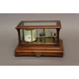 A BAROGRAPH BY SHORT & MASON OF LONDON, gilt metal with silvered bellows, in a mahogany case with