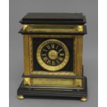 A 19TH CENTURY FRENCH BLACK SLATE AND GILT MANTEL CLOCK, the 4" black and gilt dial on an eight