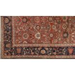 A FERAGHAN MAHAL CARPET, WEST IRAN, c.1890, the tomato red field with an all over design of large