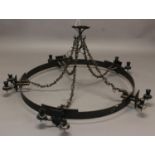 A LARGE GOTHIC REVIVAL STYLE IRON CHANDELIER, of circular form with five double sconces (fitted