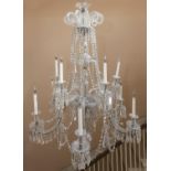 A 19TH CENTURY CUT GLASS CHANDELIER, c.1870, the scrolling spiral crown above swags of lustres and