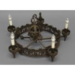 A GOTHIC REVIVAL STYLE IRON CHANDELIER, of circular form with five bronzed sconces, the pierced