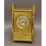 A FRENCH GILT MANTEL CLOCK, the 5" silvered dial on a brass eight day movement stamped 'V.R'