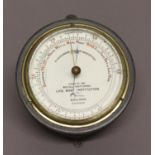 A FISHERMANS ANEROID BAROMETER, by Dollond, London, No.2756, issed by the Royal National Life Boat