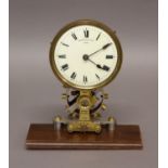 AN ELECTRIC 'EUREKA' TIMEPIECE, the 4 1/2" cream dial signed 'Eureka Clock Co. Ltd' on a brass frame