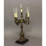 A FRENCH FIVE BRANCH GILT CANDELABRA, 19th century, the scrolling branches on a column supported