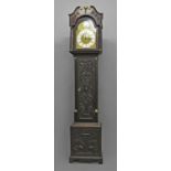 AN OAK LONGCASE CLOCK BY VALE OF COLESHILL, with an arched brass dial, the arch with a convex