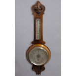 AN EDWARDIAN ANEROID BAROMETER BY DOLLOND OF LONDON, with a broad silvered dial 'British Made