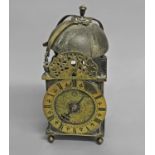 A LATE 17TH CENTURY LANTERN CLOCK, the 6 1/4" dial with brass chapter ring and floral engraved