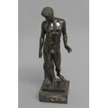 AFTER THE ANTIQUE; an 18th or 19th century cast and patinated sculpture after the antique of a naked