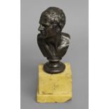 AFTER THE ANTIQUE; a grand tour cast and patinated bronze bust of a man looking to his right,