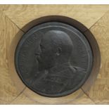 A BRONZE PLAQUE OF KING EDWARD VII, a cast and patinated circular portrait of Edward VII, bare