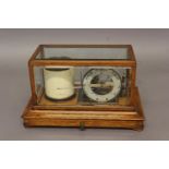 AN EDWARDIAN OAK CASED LIBRARY BAROGRAPH, early 20th century, the case with bevelled glass panels