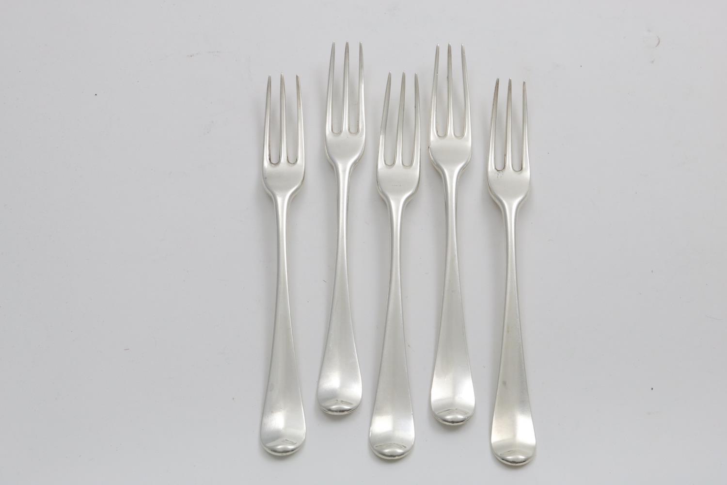 A SET OF FIVE LATE GEORGE II HANOVERIAN THREE-PRONG TABLE FORKS engraved with a coat of arms, by