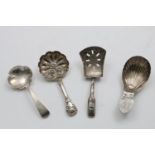A WILLIAM IV CADDY SPOON with an embossed, shaped circular bowl and a hollow, patterned stem, by