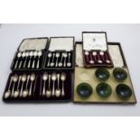 CASED SETS:- A set of six Art Deco tea spoons, initialled, two sets of six coffee spoons, a set of