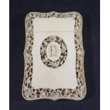 CHINESE IVORY CARD CASE the central panel with initials surrounded by carved flowers, with a further