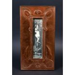 ARTS & CRAFTS COPPER FRAME with a stylised floral design and hand beaten decoration, with intials in