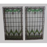 PAIR OF LEADED STAINED GLASS PANELS of rectangular shape with an Art Nouveau stylised floral design,