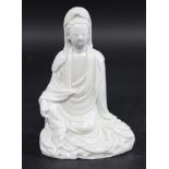 CHINESE FIGURE OF GUANYIN 18th or 19thc, the blanc to chine figure seated. Hand chipped, 14.5cms