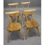 SET OF FOUR ERCOL STACKING CHAIRS a vintage set of four dining chairs with light elm seats and beech