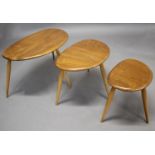 ERCOL VINTAGE 'PEBBLE' NEST OF TABLES a set of three light elm and beech graduated coffee tables,