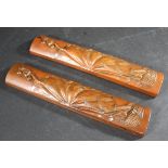CHINESE WOODEN SCROLL WEIGHTS two carved wooden scroll weights of curved shape and narrow form,