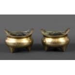 PAIR OF CHINESE BRONZE CENSORS probably 18th or 19thc, with curved loop handles to each side and