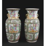 PAIR OF CHINESE CANTONESE VASES a pair of 19thc famille rose vases, the panels painted with a