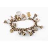 A 9CT GOLD CURB LINK BRACELET each link marked 9 375, with padlock clasp and suspending assorted