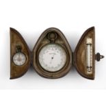 A CASED TRAVELLING SET of a metal barometer, a compass and a thermometer, the barometer 50mm dia