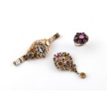 A PASTE SET BROOCH of foliate form, mounted with white, pink, yellow and green paste stones, 5.5cm