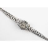 A LADY'S DIAMOND COCKTAIL WRISTWATCH BY JAEGER-Le-COULTRE the signed circular dial with Arabic