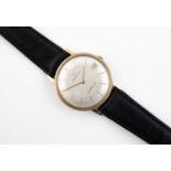 A GENTLEMAN'S 9CT GOLD WRISTWATCH BY ETERNA-MATIC the signed circular dial with baton numerals and