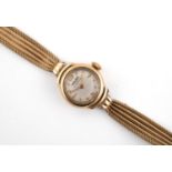 A LADY'S 9CT. GOLD WRISTWATCH the circular dial with two Arabic numerals at 12 and 6 o'clock and