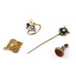A BLACK ENAMEL AND PEARL SET STICK PIN set in gold, with locket compartment to the reverse