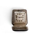 AN ART DECO SILVER TRAVELLING WATCH BY GUBELIN the square shaped dial signed E. Gubelin, Lucerne,