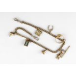 A 9CT GOLD CURB LINK WATCH CHAIN suspending assorted gold charms, including an 18ct gold signet