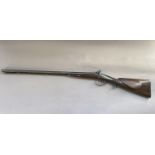 A MID 19TH CENTURY MUZZLE LOADING SHOTGUN. With twin side-by-side 72.5cm barrels with ram rod below,