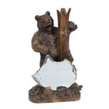 BLACK FOREST BEAR - MIRROR a large figure of an upright bear, leaning against a tree trunk and