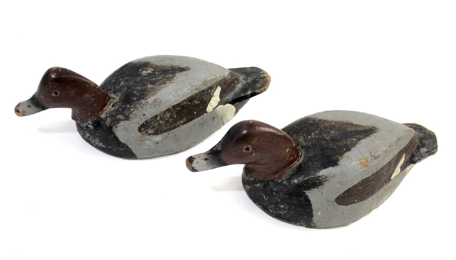 FOLK ART INTEREST - ANTIQUE DECOY DUCKS a pair of late 19thc/early 20thc wooden and painted decoy