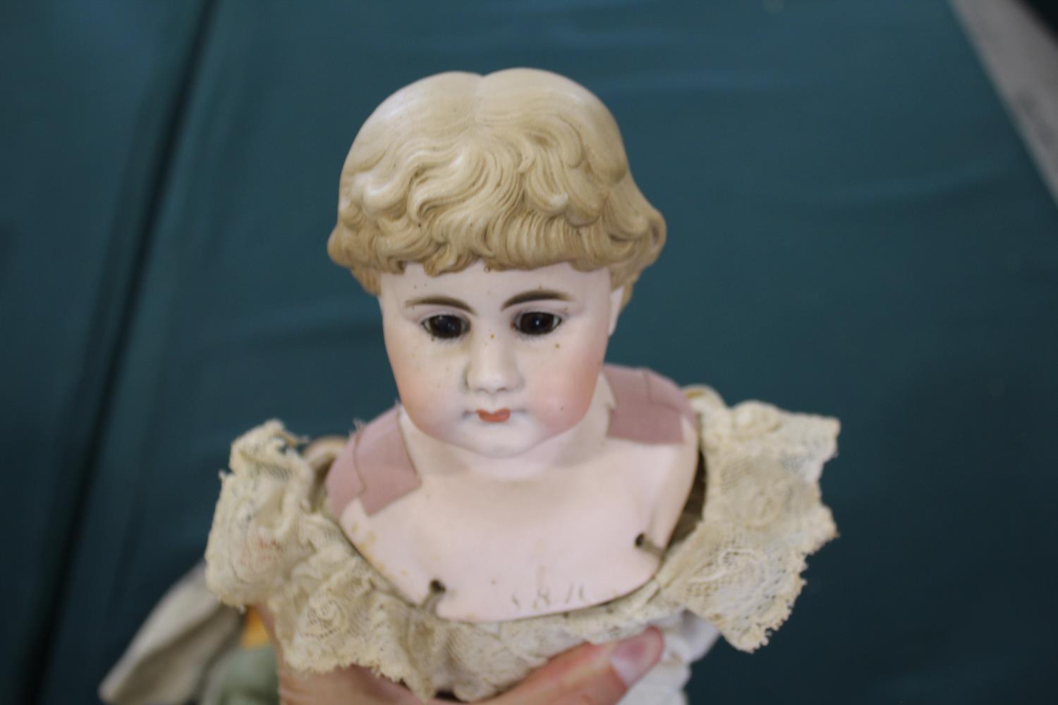 BISQUE HEAD ORIENTAL DOLL with a bisque head with fixed brown eyes, composition body and limbs and - Image 9 of 10