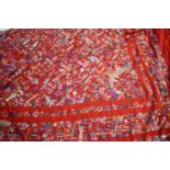 CHINESE SILK SHAWL a late 19thc/early 20thc red silk shawl, embroidered with small figures,