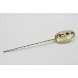 A GEORGE I SILVERGILT MOTE SPOON with a plain rattail and a small diamond point terminal, maker's