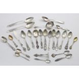 A MIXED LOT:- 18 various North American/Canadian souvenir spoons, a matching spoon, butter knife and